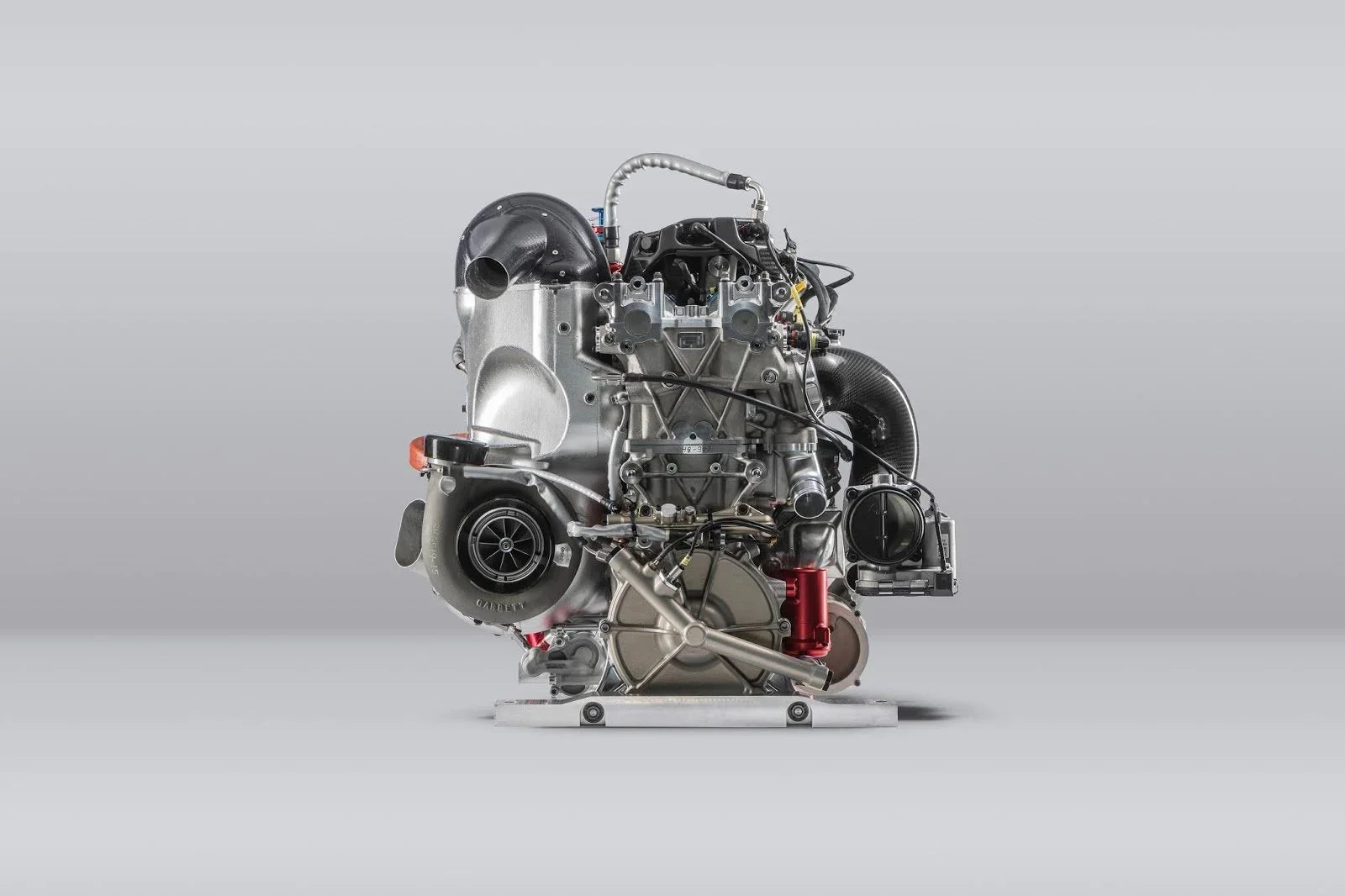 Turbocharged race engine side view showing the turbocharger and throttle body