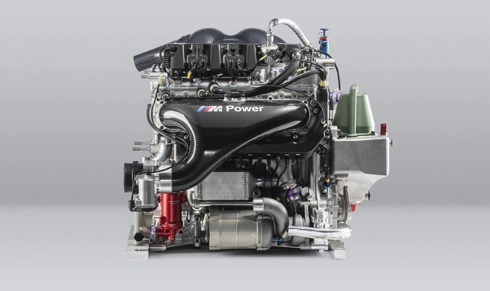 BMW M Power race engine side view with carbon-fibre intake and M Power cover
